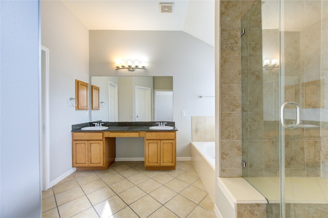 bathroom with plus walk in shower, vanity, vaulted ceiling, and tile patterned floors