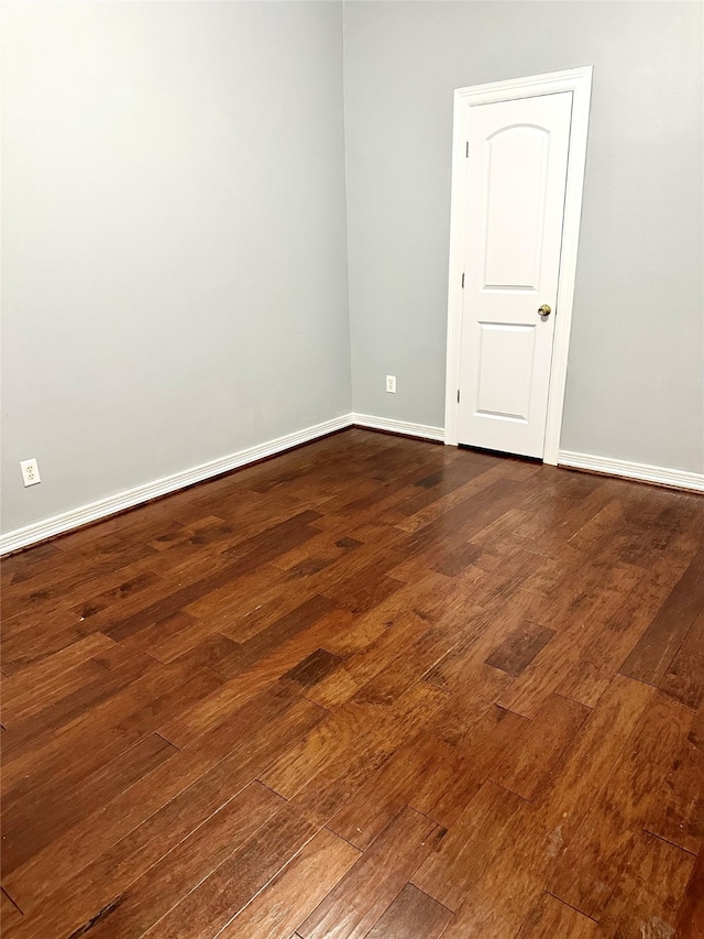 unfurnished room featuring dark hardwood / wood-style floors