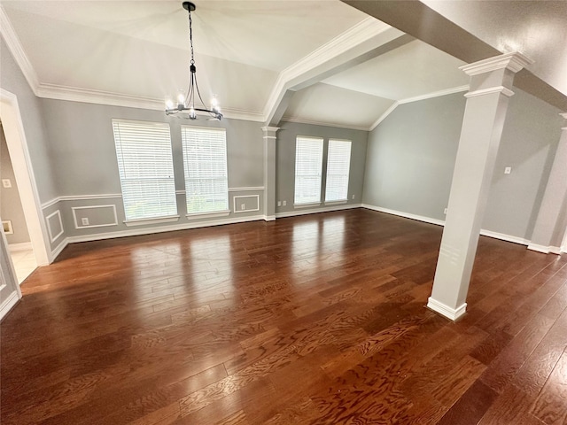 unfurnished living room with lofted ceiling, dark hardwood / wood-style flooring, ornate columns, and crown molding