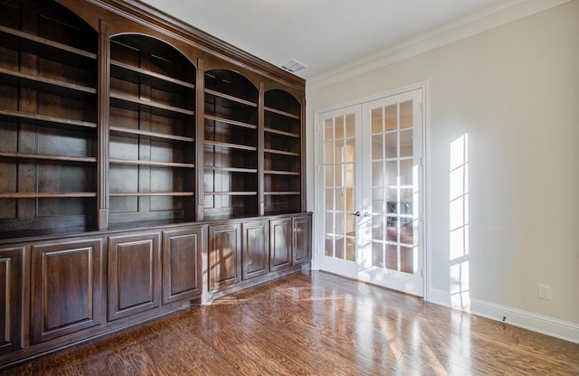 interior space featuring crown molding, dark wood-type flooring, and french doors