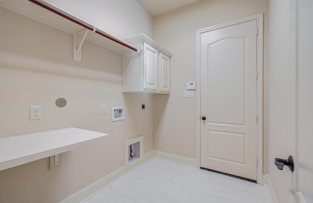 clothes washing area featuring hookup for an electric dryer, gas dryer hookup, cabinets, and washer hookup