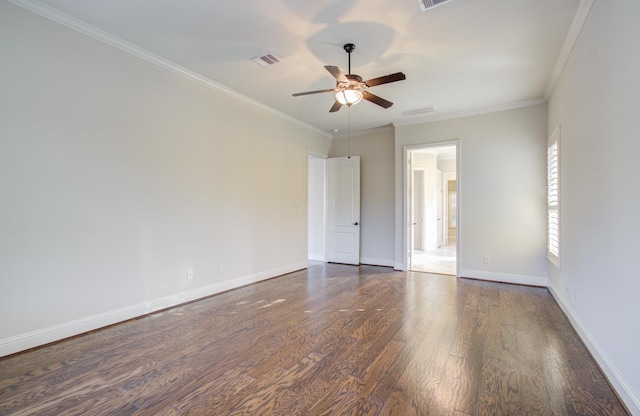 empty room with dark hardwood / wood-style floors, ceiling fan, and ornamental molding