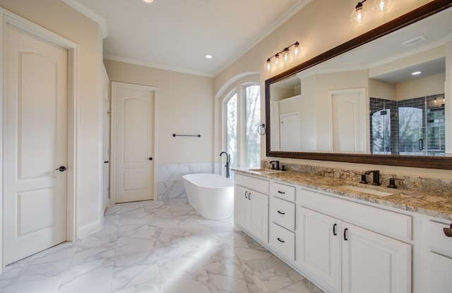 bathroom with vanity, ornamental molding, and independent shower and bath