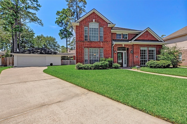 view of property featuring a front lawn