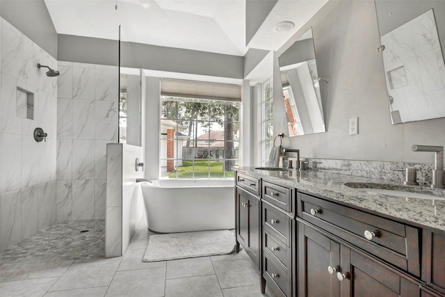 bathroom featuring tile patterned flooring, vanity, separate shower and tub, and vaulted ceiling