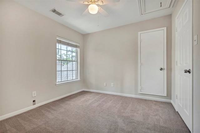 spare room with carpet flooring and ceiling fan