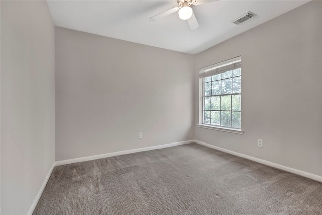 carpeted empty room featuring ceiling fan