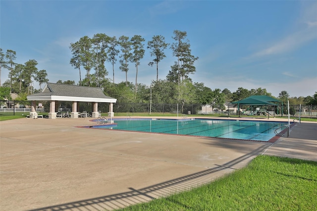 view of swimming pool with a gazebo and a patio area