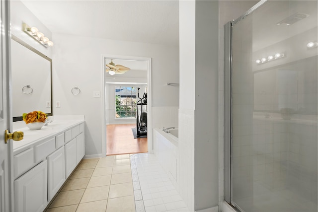 bathroom featuring tile patterned floors, plus walk in shower, vanity, and ceiling fan