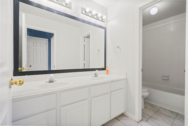 full bathroom featuring vanity, toilet, and tiled shower / bath combo