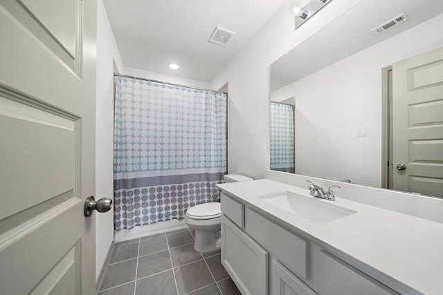 full bathroom with tile patterned flooring, vanity, toilet, and shower / bath combo with shower curtain