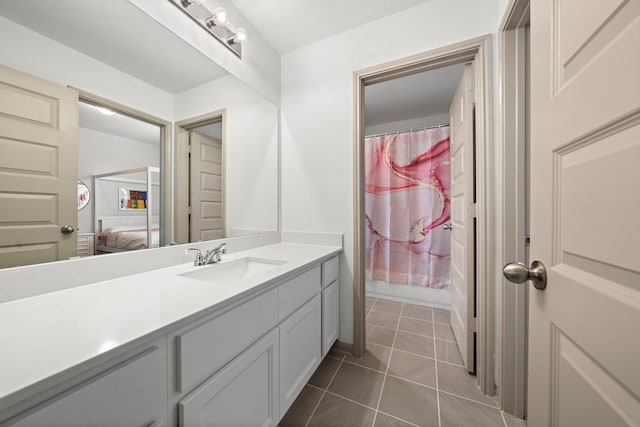 bathroom with tile patterned flooring, vanity, and shower / bath combination with curtain