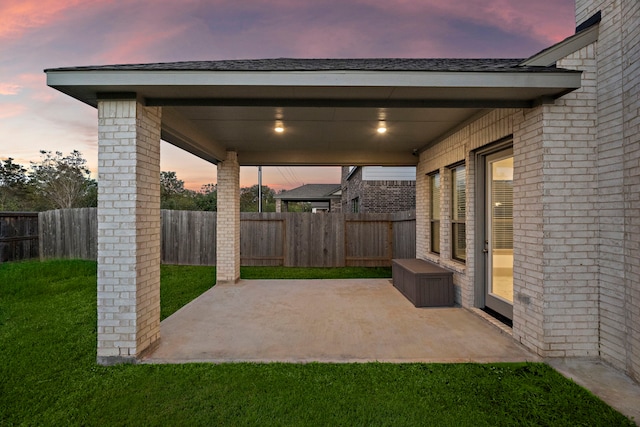 view of patio terrace at dusk