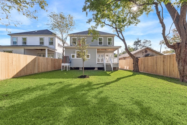 rear view of house with a lawn