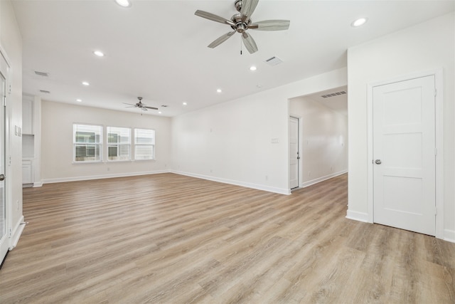 unfurnished room with ceiling fan and light hardwood / wood-style floors