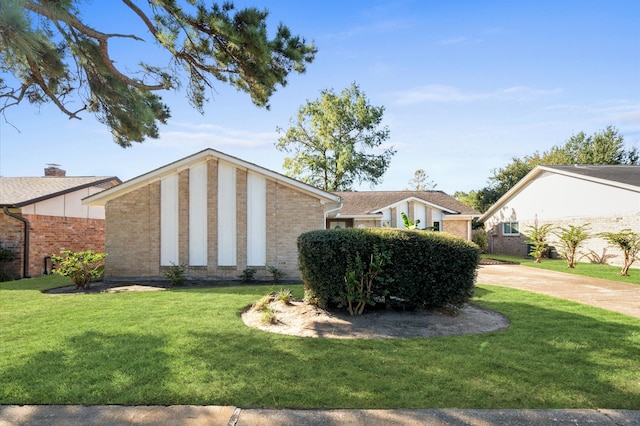 view of property exterior with a yard