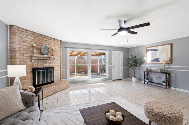 tiled living room featuring ceiling fan and a brick fireplace