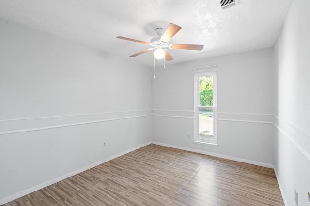 unfurnished room featuring ceiling fan and hardwood / wood-style floors