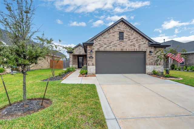 view of front facade with a garage and a front lawn