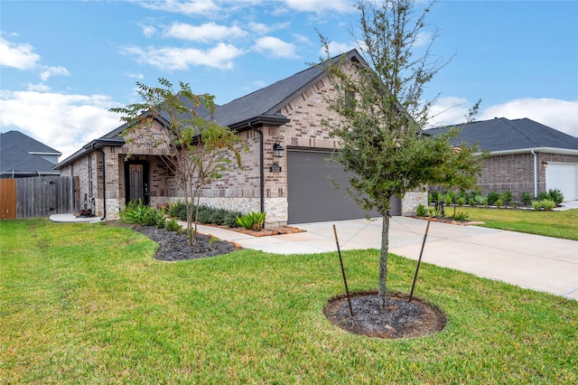 view of front of house with a garage and a front lawn