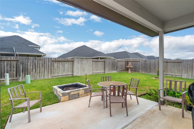 view of patio / terrace with an outdoor fire pit