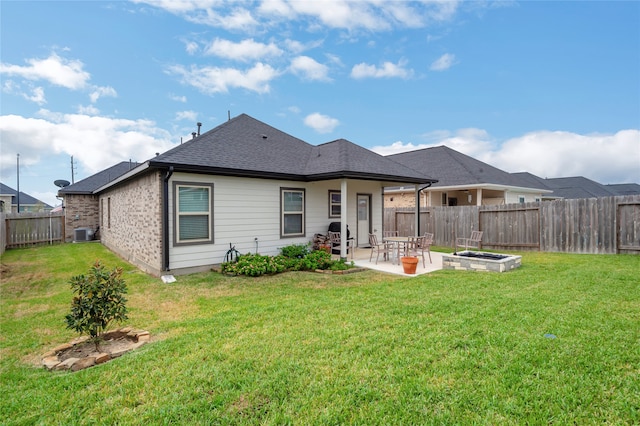 back of property featuring a yard and a patio