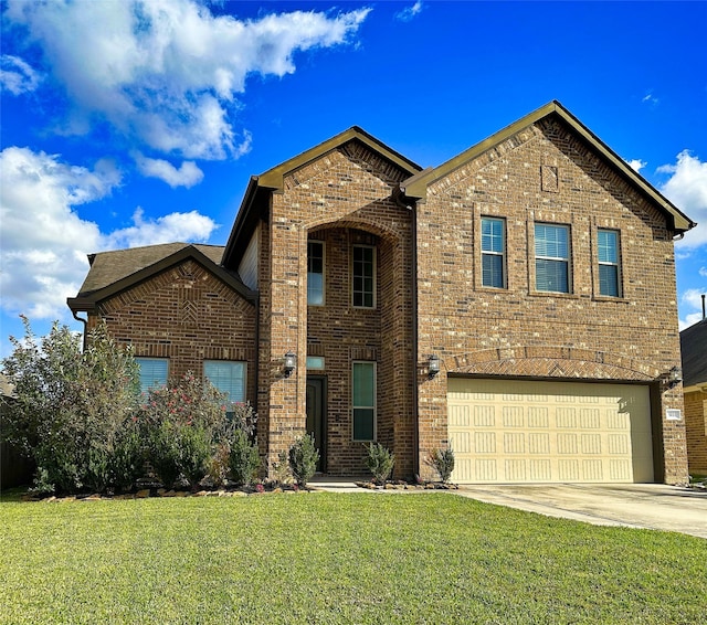 front of property with a front yard and a garage