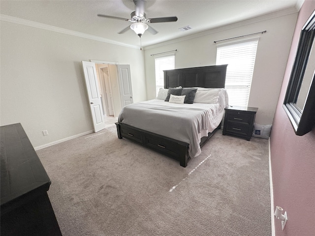 carpeted bedroom featuring ceiling fan and ornamental molding