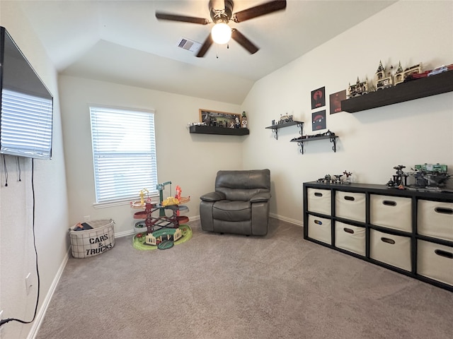 playroom featuring ceiling fan, light colored carpet, and vaulted ceiling