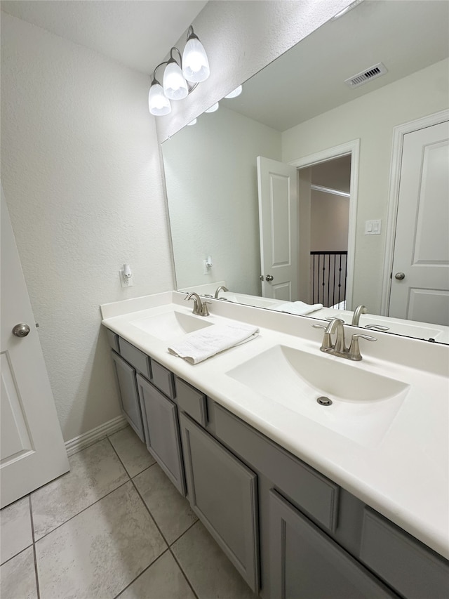 bathroom with tile patterned flooring and vanity