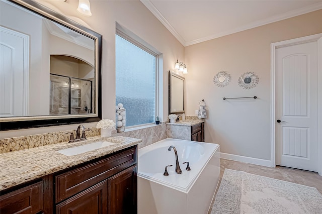 bathroom featuring crown molding, separate shower and tub, a healthy amount of sunlight, and vanity