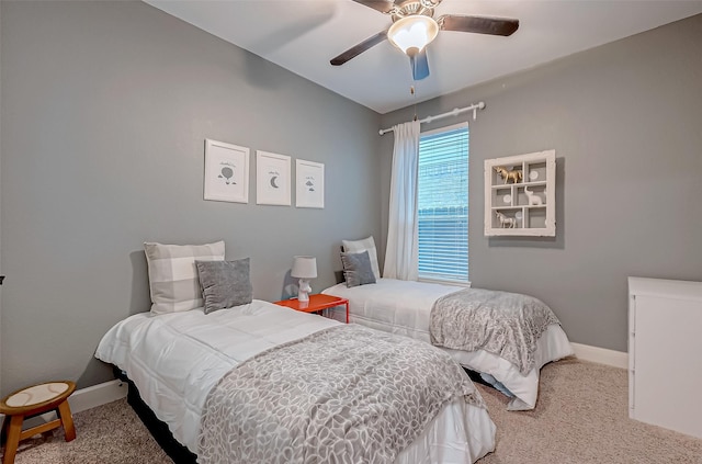 bedroom featuring light carpet and ceiling fan