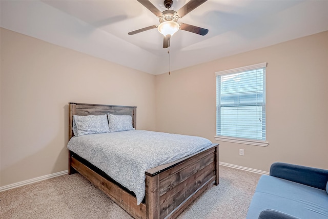 carpeted bedroom featuring lofted ceiling and ceiling fan