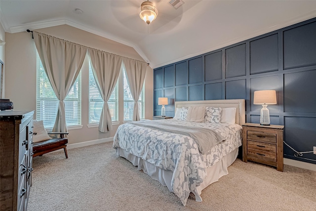 bedroom with crown molding, light colored carpet, lofted ceiling, and ceiling fan