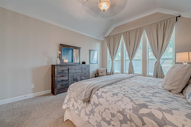 bedroom featuring crown molding, light colored carpet, lofted ceiling, and multiple windows