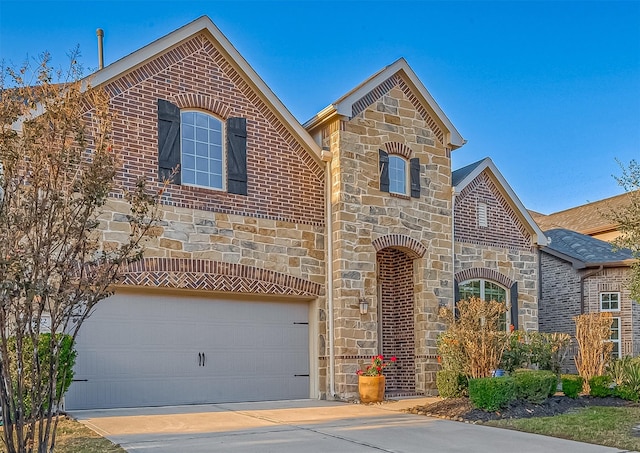 front of property with a garage