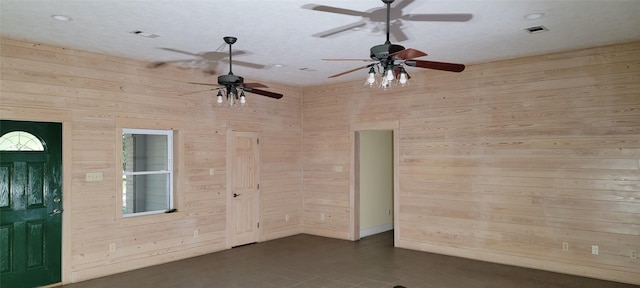 interior space with wooden walls and a healthy amount of sunlight