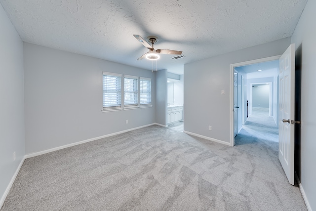 interior space with ceiling fan and a textured ceiling