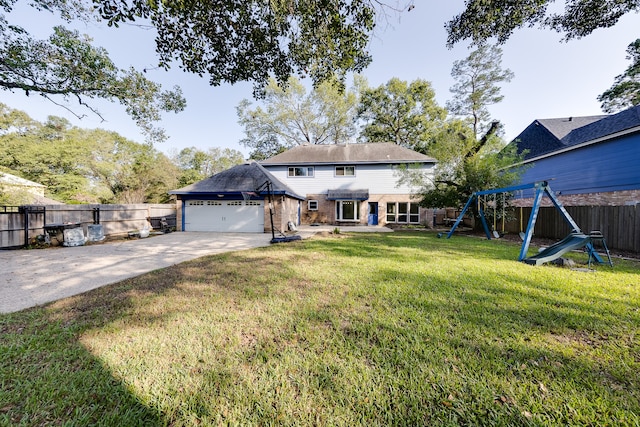 view of front facade featuring a garage, a playground, and a front lawn