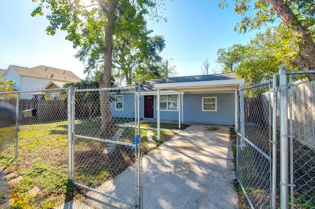 ranch-style home featuring a carport