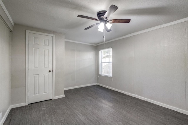 unfurnished bedroom featuring ceiling fan, ornamental molding, and dark wood-type flooring