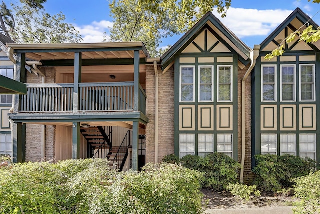 rear view of property with a balcony