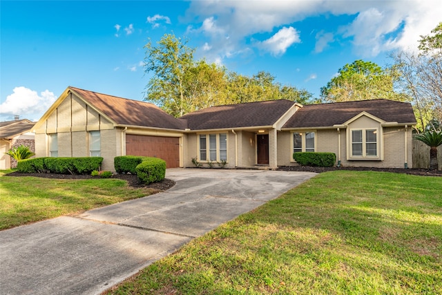 single story home featuring a front lawn and a garage