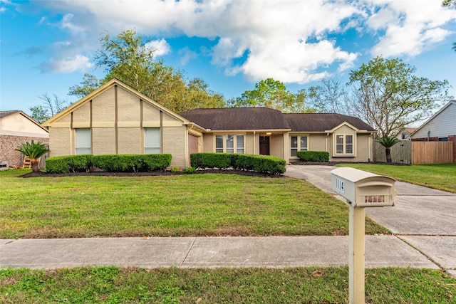 single story home featuring a front yard