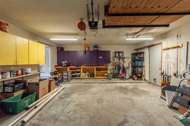 garage featuring a workshop area and a garage door opener