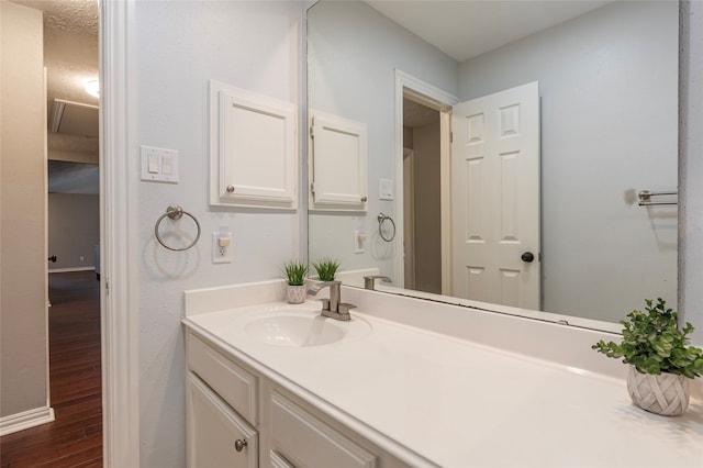 bathroom featuring vanity and hardwood / wood-style flooring