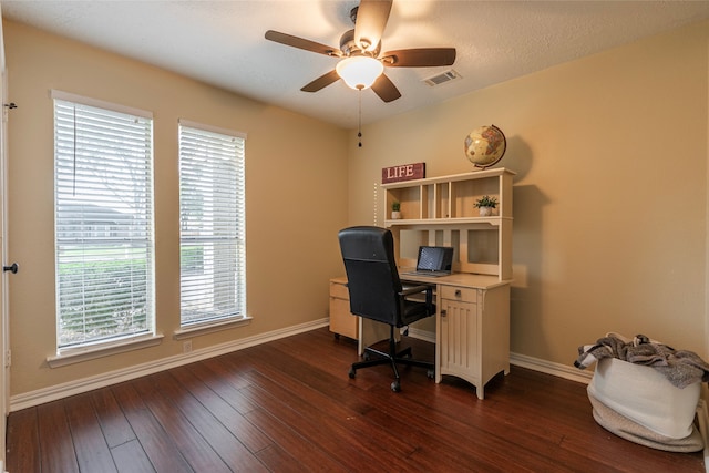 office featuring ceiling fan, dark wood-type flooring, and a textured ceiling