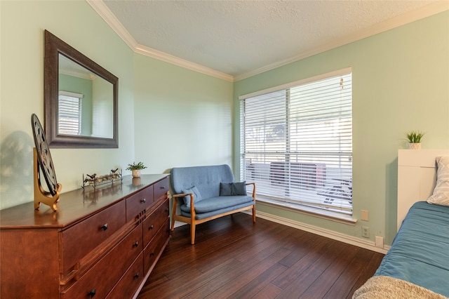 sitting room with a wealth of natural light, crown molding, dark wood-type flooring, and a textured ceiling