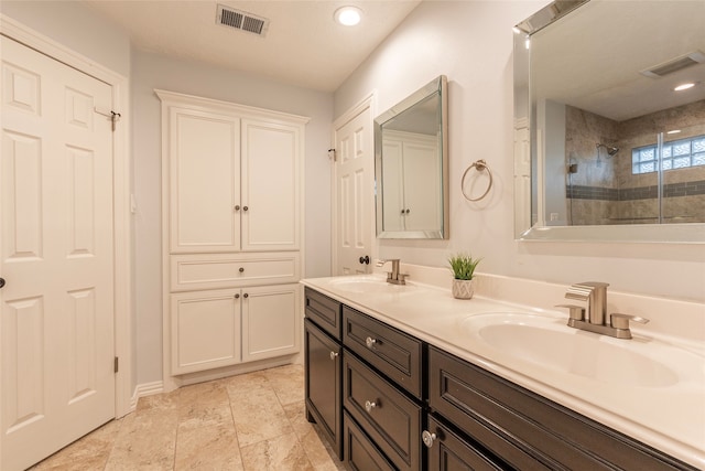 bathroom featuring vanity and a shower with shower door