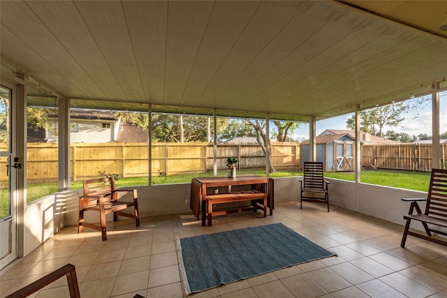 sunroom with plenty of natural light and wooden ceiling